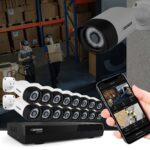 Security cameras and smartphone surveillance app display.