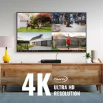 4K Ultra HD TV on wooden stand.