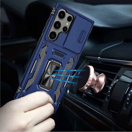 Phone in rugged case near car mount.