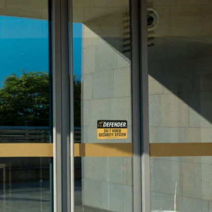 Glass door with security system sign.