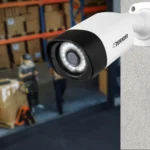 Security camera overlooking warehouse with boxes.