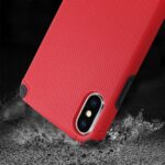 Close-up of a red phone case on a smartphone with a dual-camera setup.