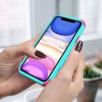 Person holding smartphone with colorful case.