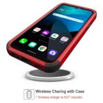 Smartphone in a red case wirelessly charging on a pad.