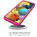 Smartphone with a pink wireless charging case on a stand.