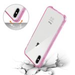 Pink edge clear phone case protecting a smartphone with cracked surface beneath.