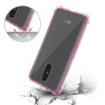 Transparent phone case with pink edges protecting a smartphone.