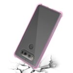 A smartphone with a pink case cracking the surface beneath it.