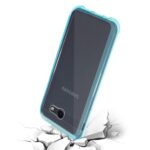 A smartphone with a blue case cracking the surface beneath it.