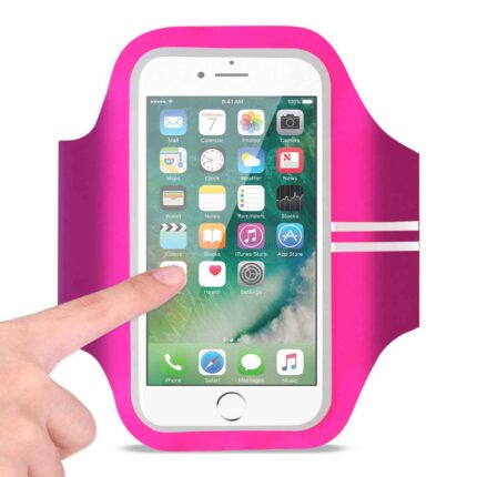 Hand touching a smartphone in a pink sports armband.