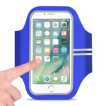 Blue armband phone holder with a finger touching the screen.