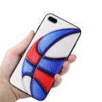 Hand holding a smartphone with a colorful abstract back cover.