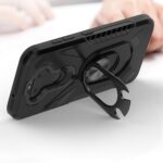 Black phone stand case with ring holder supporting a phone horizontally.