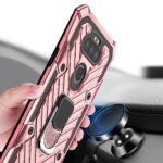 A hand holding a pink rugged phone case with a ring holder, near a car dashboard mount.