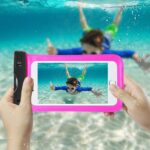 Underwater photo of a boy snorkeling, captured on a smartphone.