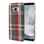Smartphone with a red and gray plaid patterned case.