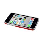 Smartphone lying flat with colorful app icons on screen.