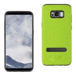 Smartphone with a green textured case and a black kickstand.