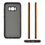 Black phone case with orange sides for a smartphone.