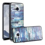 Phone case with a blue and purple brick wall design.