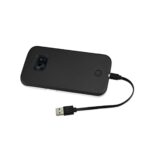 Black external hard drive with USB cable connected.