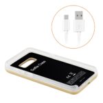 Wireless charging phone case with USB cable.