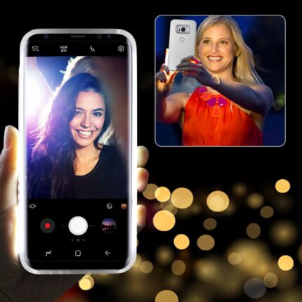 Woman taking a selfie with a smartphone, smiling brightly.