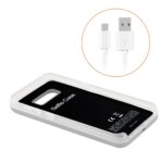 White external battery pack with USB cable.