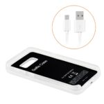 White wireless charger with USB cable and power bank feature.