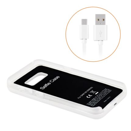 White wireless charger with USB cable and power bank feature.
