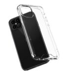 Clear protective phone case with reinforced corners beside a black smartphone.