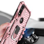 Close-up of a hand holding a pink rugged phone case with geometric design and camera cutouts.