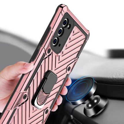 Hand holding a rose gold phone case with a built-in ring holder.