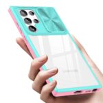 Hand holding a turquoise and pink phone case with camera cover.