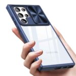 A hand holding a transparent phone case with a blue camera cover.