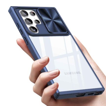 A hand holding a transparent phone case with a blue camera cover.