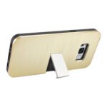 Gold-colored smartphone case with a built-in kickstand.