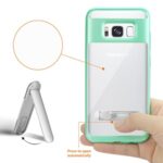 Phone stand with adhesive grip pad for hands-free use.