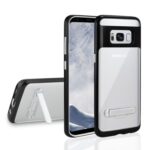 A black and white phone case with a kickstand, shown with a smartphone.